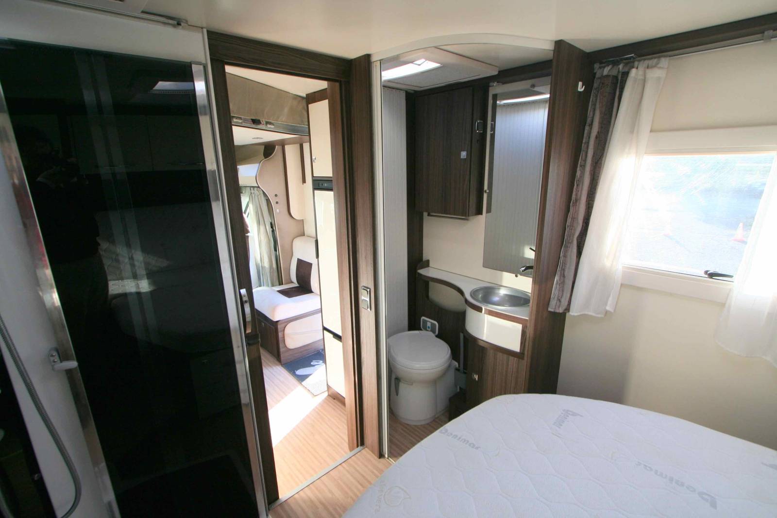 Camping-car profilé d'occasion, lit central, lit de pavillon, 5 couchages, Benimar Tessoro 495, à Roques proche de Toulouse (31)