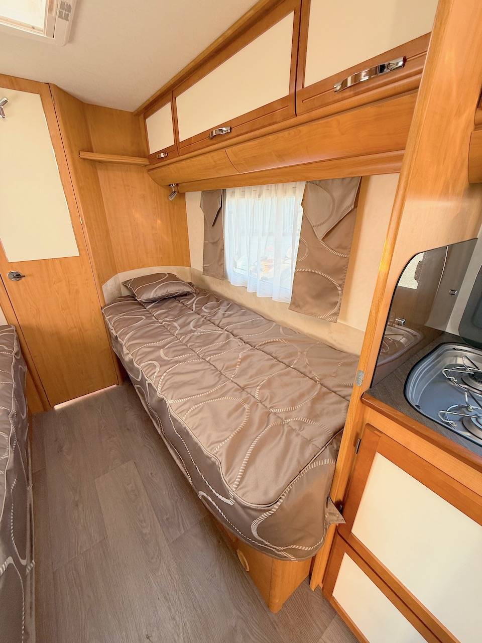 Camping-car occasion profilé, lits jumeaux, boîte automatique, 4 places, 4 couchages, Fleurette Migrateur 73 LJ, à Roques, proche de Toulouse (31)