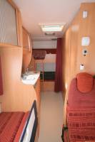 Achat Camping-car capucine occasion, petit prix, lits superposés, 7 m, double dînette, 7 couchages, 5 places carte grise, Chausson Flash 05, à Roques proche de Toulouse (31)