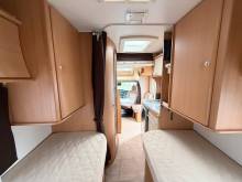 Vend Camping-car profilé occasion compact, lits jumeaux, 4 places, 3 couchages, lit de pavillon 1 place, Chausson flash 16, à Roques proche de Toulouse (31).