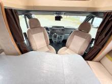 Camping-car profilé occasion compact, lits jumeaux, 4 places, 3 couchages, lit de pavillon 1 place, Chausson flash 16, à Roques proche de Toulouse (31).