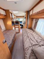 Camping-car occasion profilé, lits jumeaux, boîte automatique, 4 places, 4 couchages, Fleurette Migrateur 73 LJ, à Roques, proche de Toulouse (31)