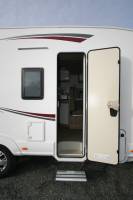 Camping-car profilé occasion, véhicule presque neuf, lit de milieu et de pavillon, 4 places, PLA 390, à Roques, proche de Toulouse (31)
