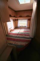 Camping-car profilé occasion, moins de 6 m, lit à la française, 4 places, Bürstner T 605, à Roques proche de Toulouse (31)