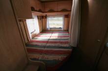 Camping-car profilé occasion, moins de 6 m, lit à la française, 4 places, Bürstner T 605, à Roques proche de Toulouse (31)