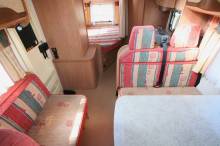 Achat Camping-car profilé occasion, moins de 6 m, lit à la française, 4 places, Bürstner T 605, à Roques proche de Toulouse (31)